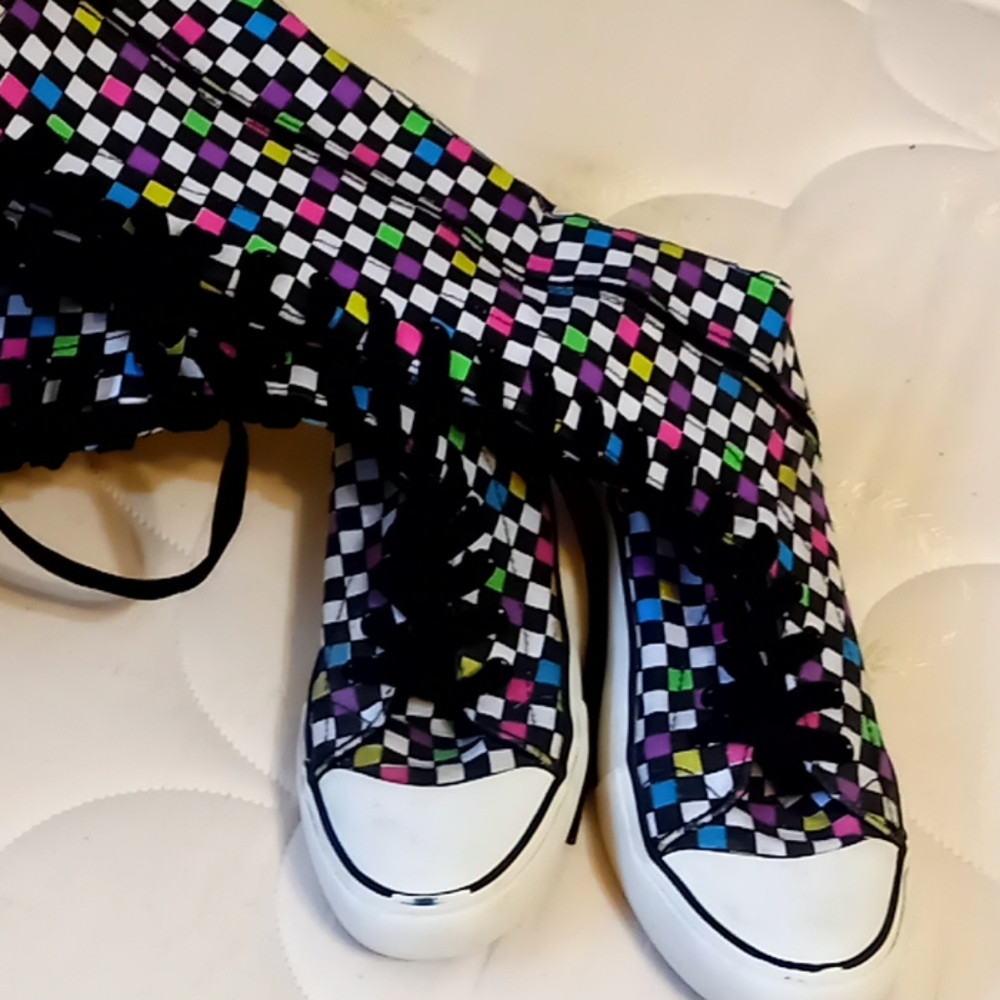 Lace up sneakers.